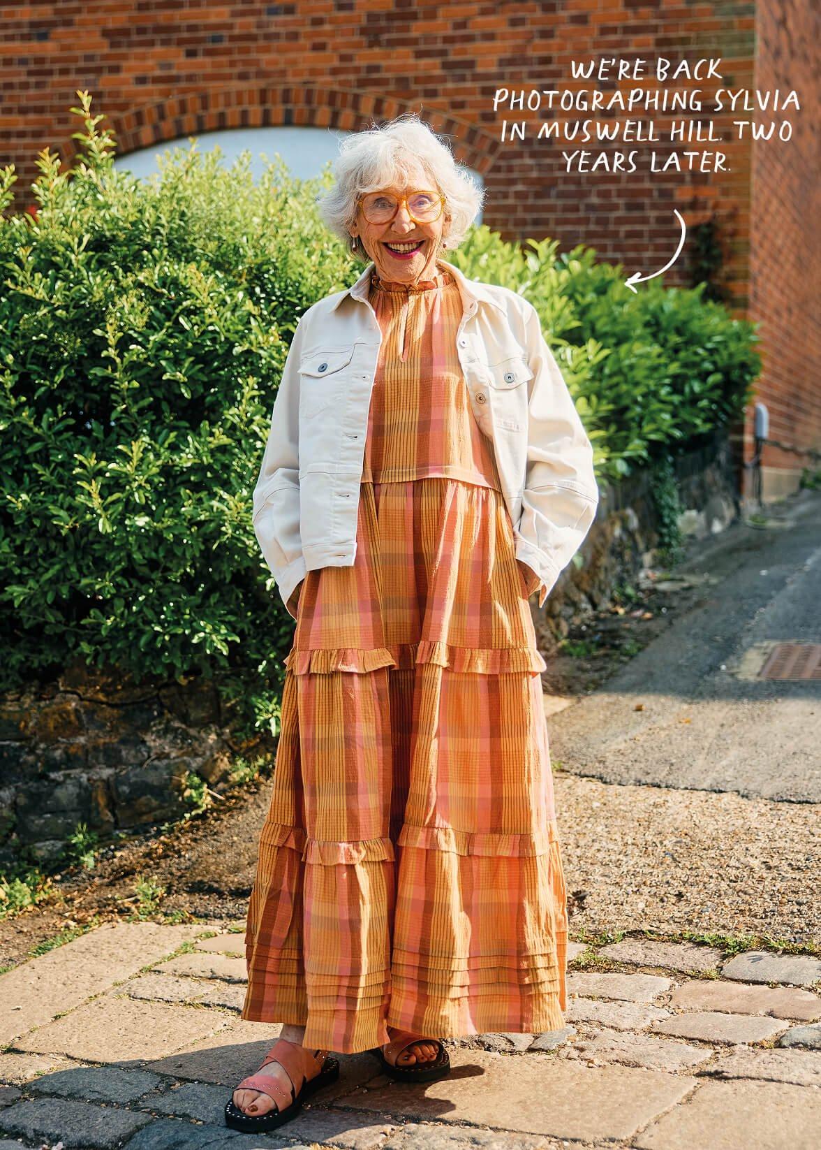 a woman standing on a brick sidewalk with a caption